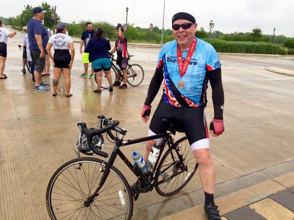 posing with medal
